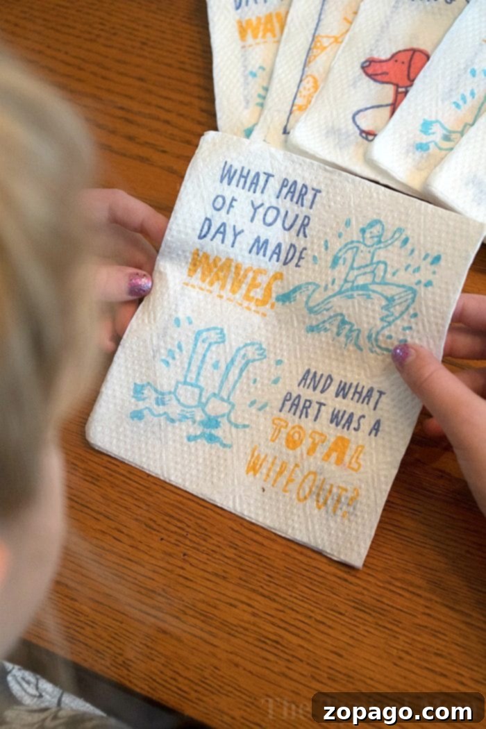 Connecting at dinnertime with Instant Pot chicken parmesan casserole and engaging conversation starters. Close-up of a napkin with a fun conversation starter question, enhancing family mealtime.