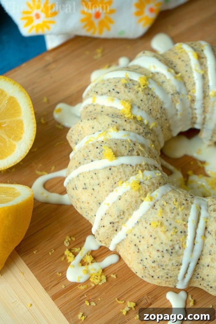 This Instant Pot lemon poppy seed cake is a remarkably simple yet elegant breakfast or brunch treat, offering a moist texture and a delightful citrus boost! A perfectly baked Instant Pot Lemon Poppy Seed Bundt Cake, showcasing its golden crust and moist interior, adorned with a delicate glaze.
