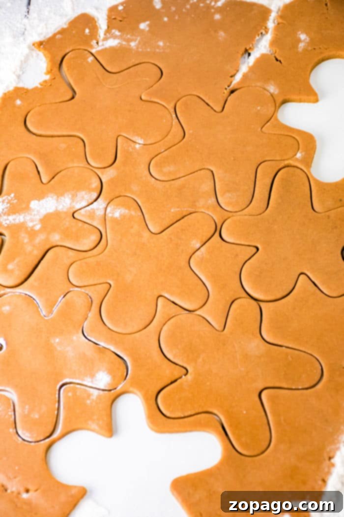 Effortless Christmas Hazelnut Cookies 2 Assortment of festive gingerbread cookies on a wooden board.