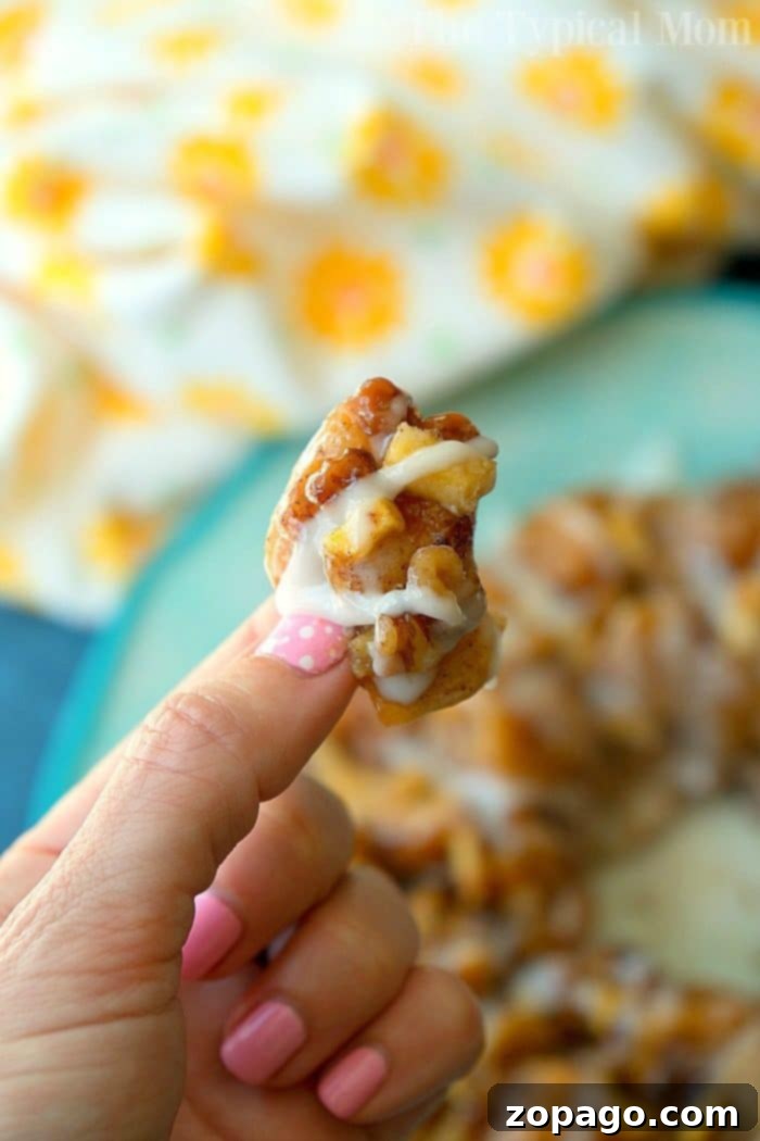 Instant Pot caramel apple monkey bread is so addicting and easy to make with ready made cinnamon rolls! If it's hot and you're not about to turn on your oven this is the new way to bake! #instantpot #pressurecooker #monkeybread #dessert #instantpotrecipes #thetypicalmom #cinnamonroll Another view of the delicious Instant Pot caramel apple monkey bread, showing its delightful pull-apart texture.