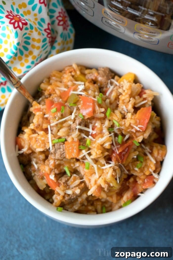 This Instant Pot stuffed pepper casserole is so flavorful and simple to make! Like deconstructed stuffed peppers in your pressure cooker but way easier! #instantpot #pressurecooker #stuffedpeppers #cassserole #instantpotrecipes #thetypicalmom Instant Pot Stuffed Pepper Casserole with ground beef and rice