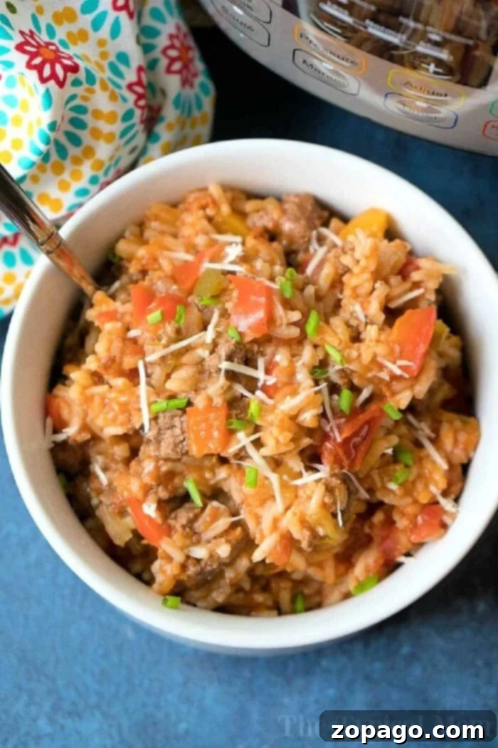 One-Pot Stuffed Pepper Dinner 8 A large serving of Instant Pot Stuffed Pepper Casserole with ground beef, perfectly cooked rice, and colorful bell peppers, ready to be enjoyed.