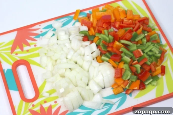 One-Pot Stuffed Pepper Dinner 3 Fresh bell peppers and onions, key ingredients for a vibrant and flavorful stuffed pepper casserole.