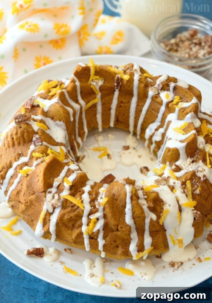 Spiced Gingerbread Pumpkin Bundt 3 Close-up of the gingerbread pumpkin bundt cake showing the moist interior and delicate glaze.