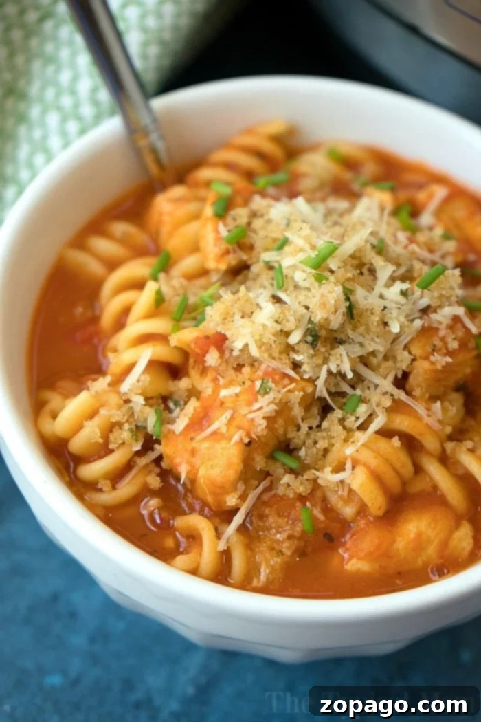 Delicious Instant Pot chicken parmesan casserole, topped with golden cheese.