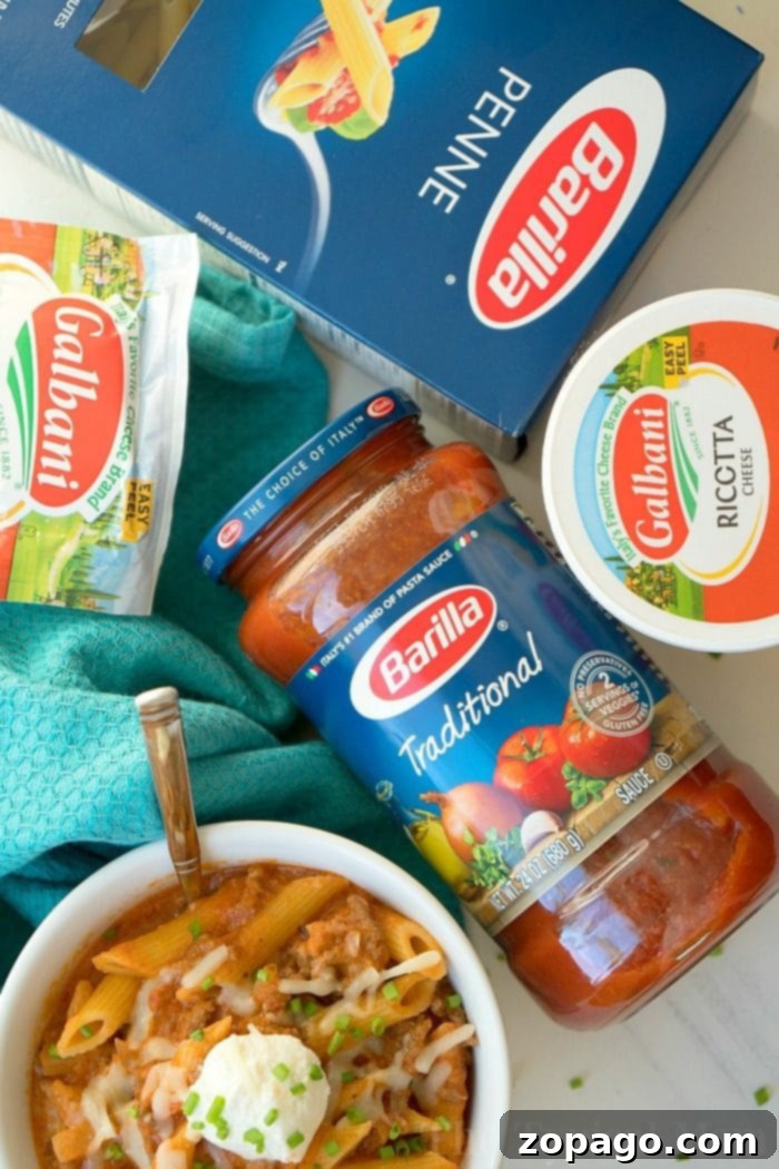 Easy Pressure Cooker lasagna casserole recipe our whole family loves. Cheesy Instant Pot lasagna but in a casserole which makes it much easier to make! #instantpot #lasagna #casserole #pressurecooker #instantpotrecipes #thetypicalmom pressure cooker lasagna casserole with penne, ricotta cheese, and spaghetti sauce