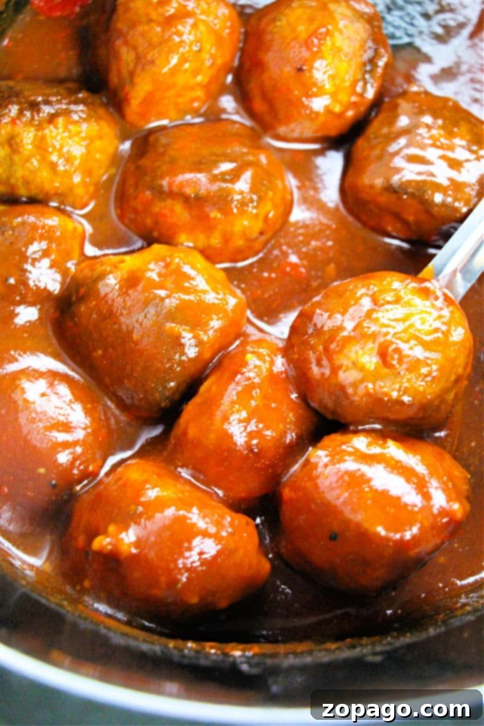 Instant Pot Frozen Meatball Magic 3 Close-up of frozen Instant Pot meatballs coated in BBQ sauce, garnished with parsley and ready to eat.