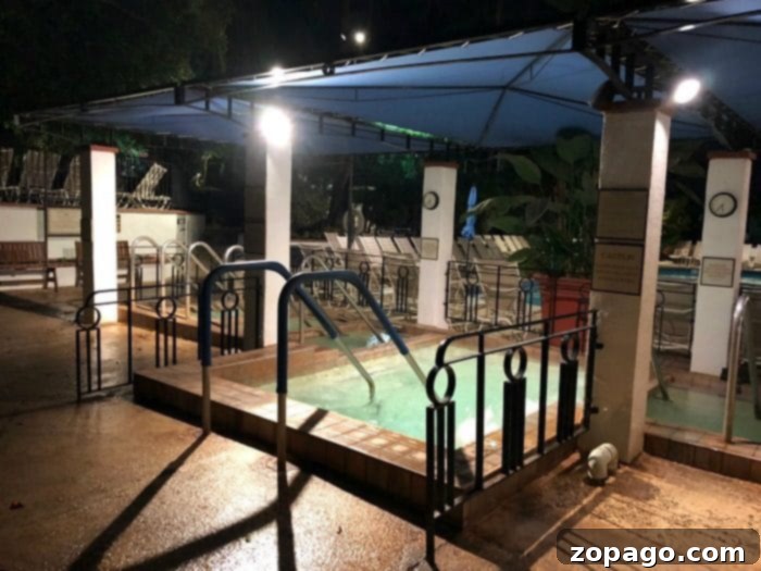 Glen Ivy Spa Corona What to Expect From Your Visit 2 Aerial view of Glen Ivy Hot Springs in Corona, California, showcasing multiple pools, lush green landscapes, and surrounding palm trees, highlighting its expansive and serene environment.