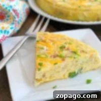 Slice of Instant Pot breakfast casserole garnished with chives and cheese, next to a full casserole.
