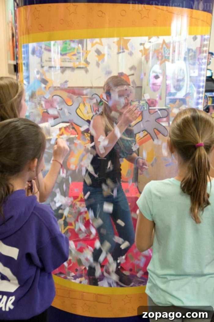 Chuck E. Cheese Birthday Parties: A Seamless Celebration for Kids Happy birthday girl posing with her friends at Chuck E. Cheese party