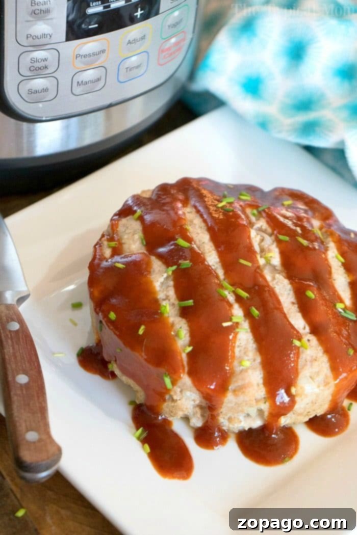 Quick-Cook Instant Pot Turkey Meatloaf 5 Individual slices of moist Instant Pot Turkey Meatloaf beautifully arranged on a white plate, highlighting its appetizing texture and rich, glossy glaze.