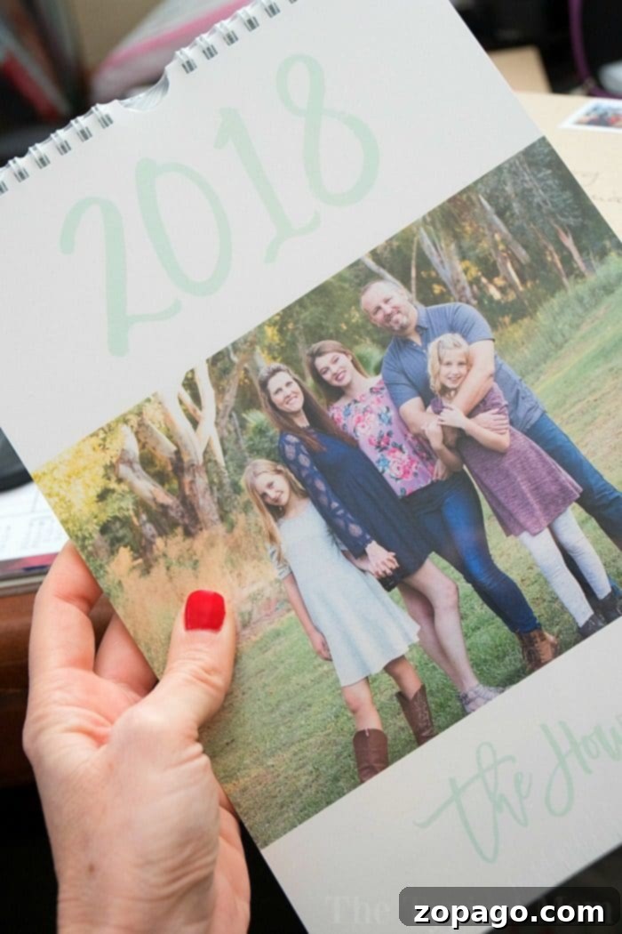 Create a cohesive set of personalized gifts and mail, including custom postage stamps and photo calendars, for a truly memorable experience. A personalized calendar featuring a family portrait alongside a custom postage stamp, showcasing a cohesive approach to custom gifts and mail for maximum impact.