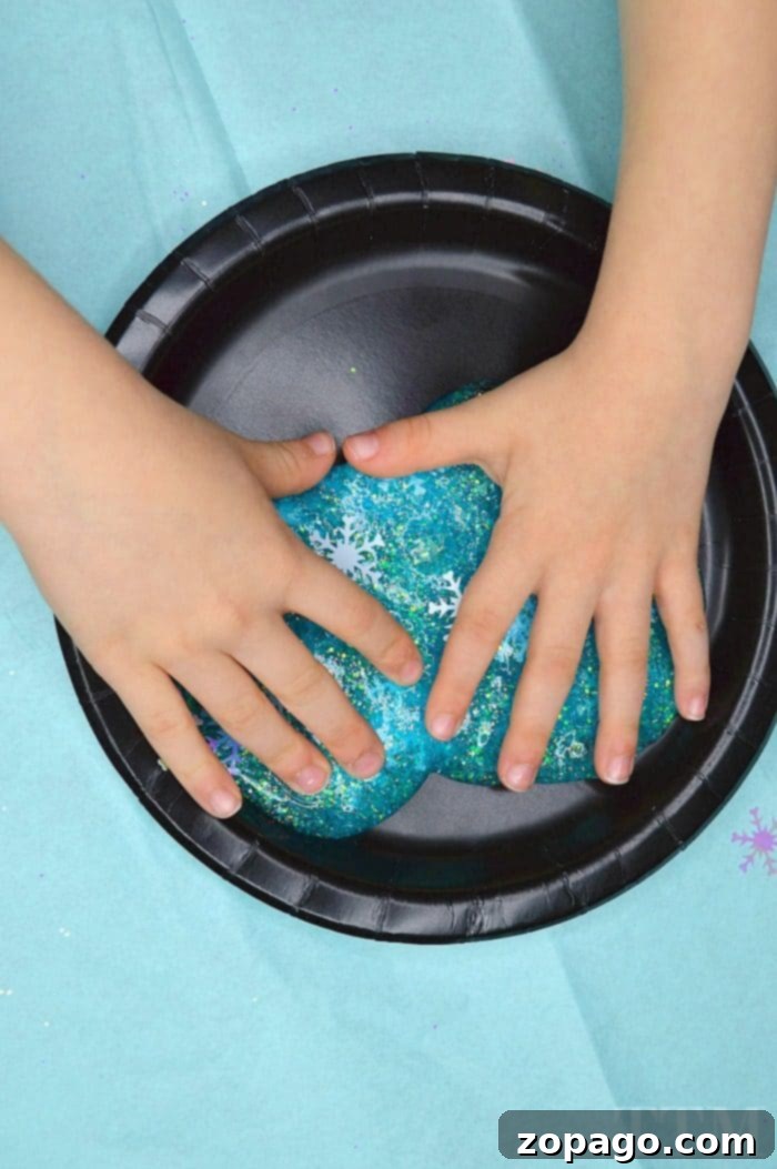 Making Winter Glitter Slime: Step-by-Step Borax-Free Recipe Winter Glitter Slime in a bowl, showing texture and shimmer