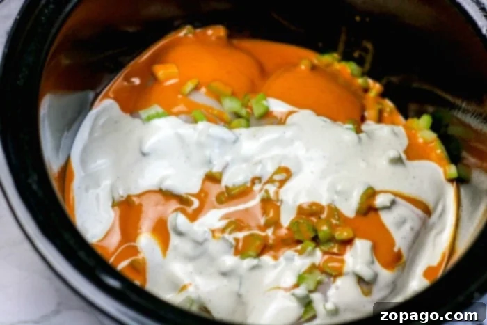 Tender Pressure Cooker Buffalo Chicken Sliders 3 Crockpot buffalo chicken sliders are a hit with this savory dip. Slow-cooked with hot sauce, ranch dressing, and chopped green onions, it's perfect for topping sliders or serving at your next gathering.