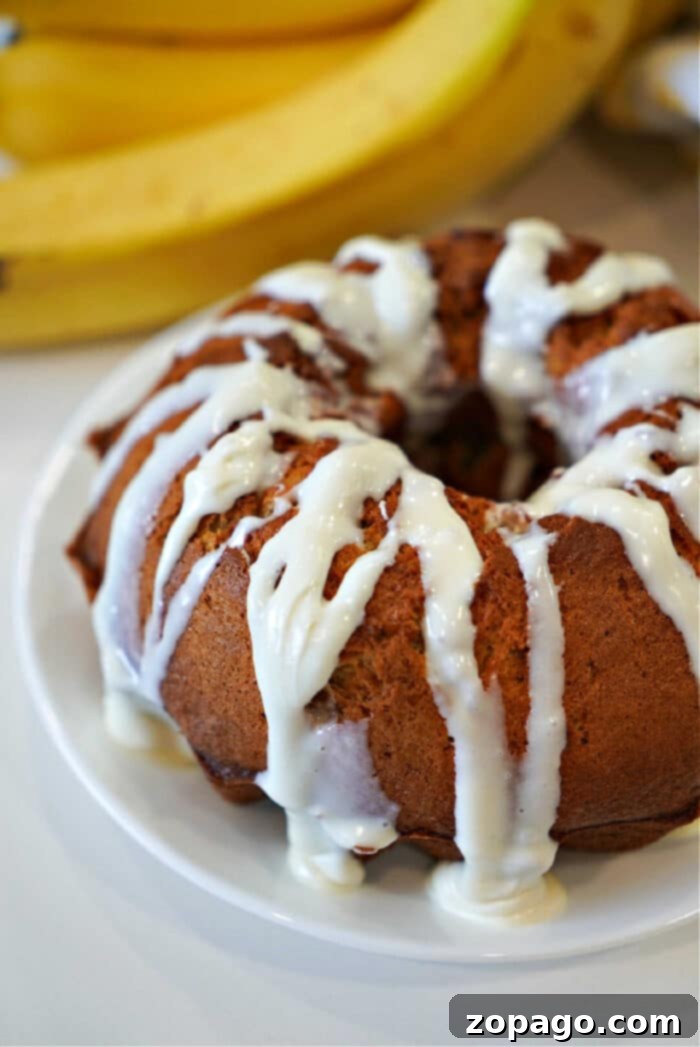 Instant Pot Banana Bread Perfection 5 pressure cooker banana bread slices served on a white plate, highlighting the moist, fluffy texture. This delicious Instant Pot banana bread is ideal for breakfast or dessert, offering a great twist with optional coconut and pineapple, all made quickly in your Instant Pot or Crock Pot Express.