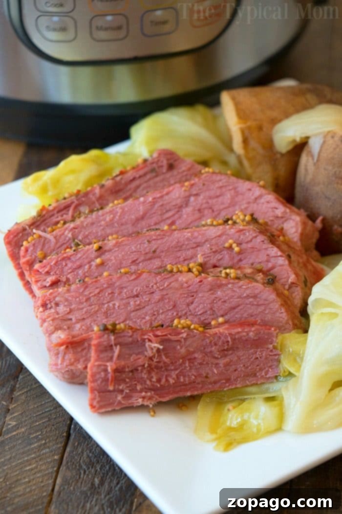 Enjoy a delectable Instant Pot corned beef and cabbage, complete with carrots, a perfect comforting meal any day. #instantpotrecipes #cornedbeef #cabbage #pressurecooker #ninjafoodi Instant Pot Corned Beef and Cabbage with Carrots and Potatoes