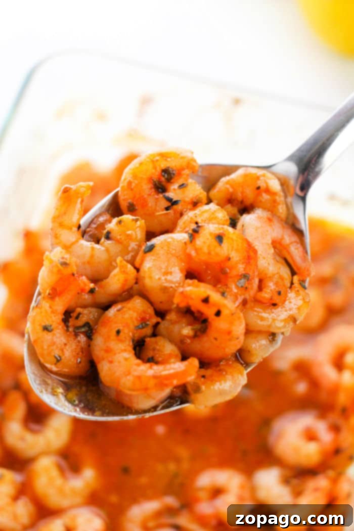 This is how you make zucchini noodles and shrimp casserole! This simple seafood dinner idea is a favorite at our house substituting vegetable noodles instead of traditional pasta. If you've never made zucchini zoodles before you are in for a real treat. Buttery and cheesy you'll love this family meal. Lemon pepper shrimp with fresh herbs, a vibrant and healthy meal.