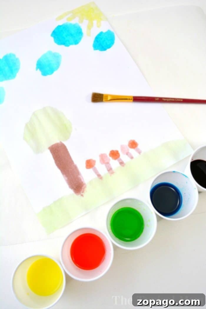 Fruity Scented Art 5 A child's watercolor painting of trees, sun, and clouds bursts with vibrant hues, reminiscent of a kool-aid paint palette. Nearby sit five small paint cups and a brush, ready for the next masterpiece.