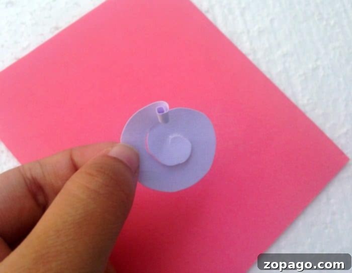 Create a Beautiful Pop Up Heart Card 3 Image showing how to cut a paper circle into a spiral for a pop up flower