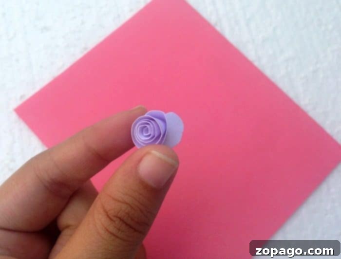 Create a Beautiful Pop Up Heart Card 4 Progress shot of rolling a paper spiral to form a 3D flower for a pop up card