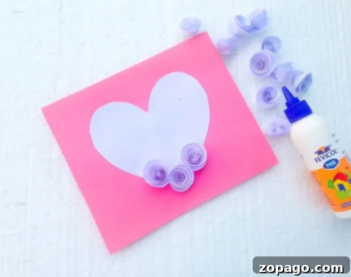 Create a Beautiful Pop Up Heart Card 6 Completed pop up heart card showcasing the full array of 3D paper flowers glued onto the heart shape