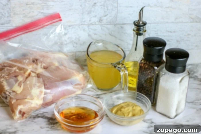 Quick Instant Pot Honey Mustard Chicken 3 Succulent boneless chicken thighs ready for the Instant Pot, coated in a rich honey mustard marinade.