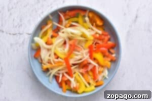 Easy Instant Pot Salsa Chicken 4 Sliced bell peppers and onions, perfect for adding to Instant Pot Salsa Chicken for extra flavor and texture.