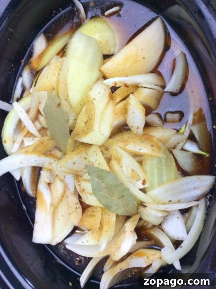 Easy Crockpot French Onion Soup 2 Rich French Onion Soup in a Crockpot, ready to be served with cheesy bread