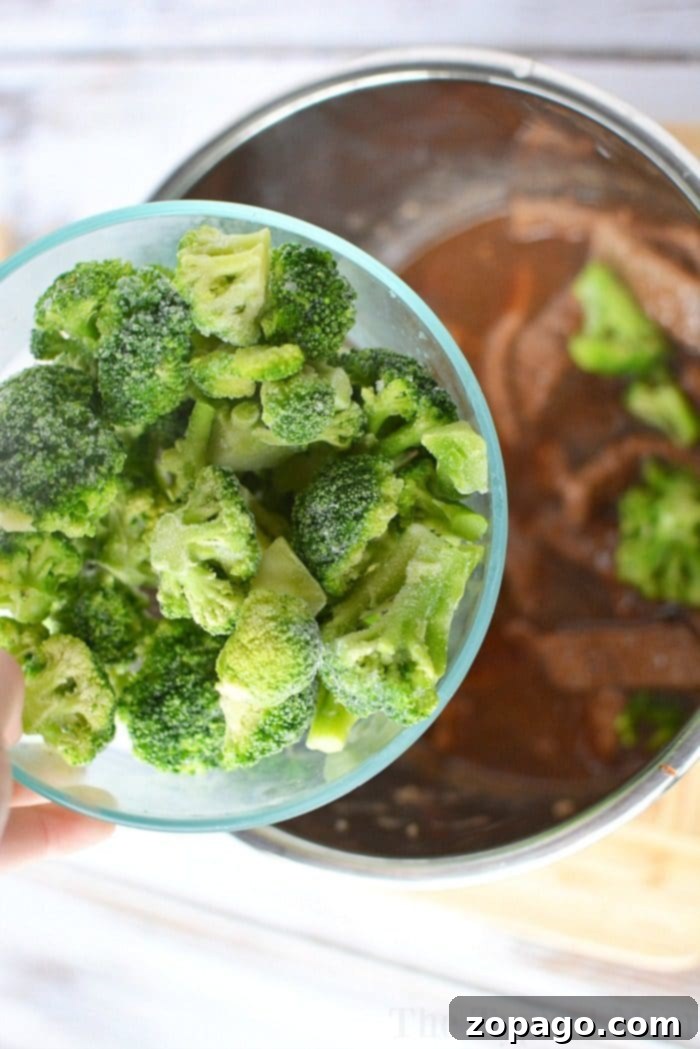 Pressure cooker beef and broccoli recipe. Made in my Instant Pot the other night it has a thick flavorful sauce and tender beef with vegetables cooked together in one pot. Pressure Cooker Beef and Broccoli served in a bowl.