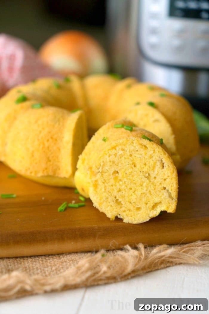 Perfectly Moist Instant Pot Cornbread 3 Close-up of golden Instant Pot cornbread in a mini bundt shape, ready to be sliced.