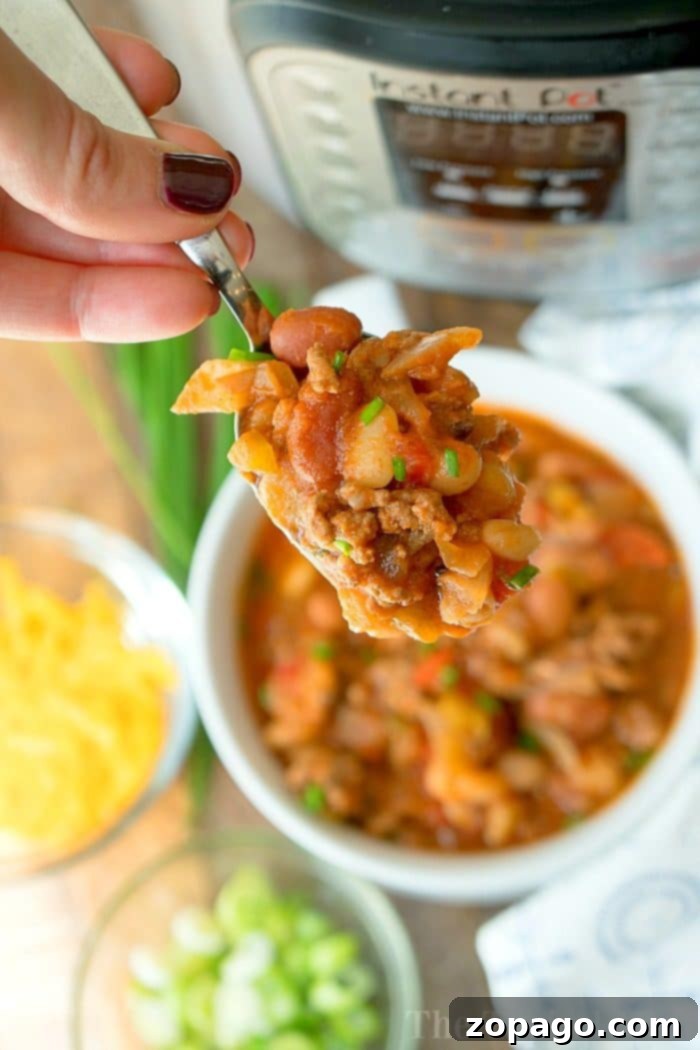 No-Soak Instant Pot Chili 2 Hearty pressure cooker chili with a mix of dry beans, served in a bowl