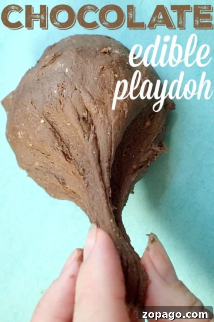 Learn the easy steps to make edible chocolate playdough. A fun, safe, 3-ingredient DIY project for kids. Get kneading! #DIYkids #ediblecrafts #playdoughrecipe #kidfriendly Hands kneading edible chocolate playdough