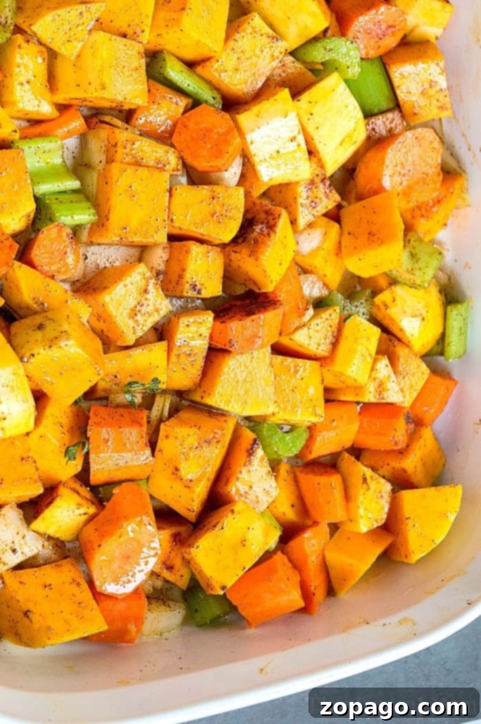 Experience the nostalgic comfort of this homemade butternut squash soup. Made with fresh, vibrant vegetables, it's a healthy, smooth, and creamy vegetarian dinner that kids adore. A flavorful and wholesome meal in every bowl. #squashsoup #vegetariansoup #butternutsquashrecipe #healthydinner #familyfriendly Homemade Butternut Squash Soup in a white bowl, garnished with fresh herbs, showcasing its rich, smooth texture.