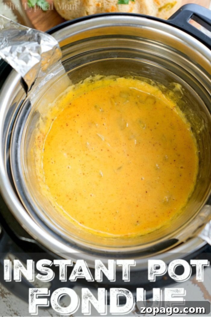 Instant Pot Fondue 2 Golden cheese fondue ready for dipping, showcasing its smooth, irresistible texture.