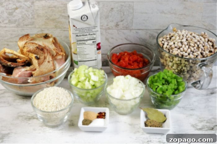 Black Eyed Peas and Ham Hocks: A Southern Comfort Classic 3 Slow Cooker Hoppin John recipe with black eyed peas, ham, and vegetables in a bowl, garnished with fresh herbs.