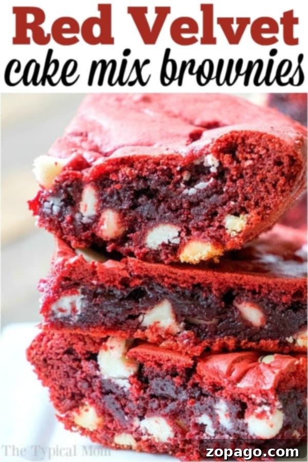 Shortcut Red Velvet Brownies 6 Two hands holding a freshly baked red velvet brownie from cake mix, showcasing its soft, moist interior and delicious texture.