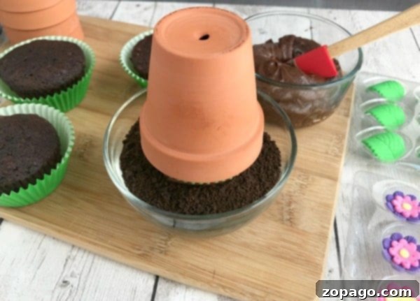 Flower Pot Cupcake Magic 4 A baked chocolate cupcake in a colorful liner, ready to be transformed into a flower pot cupcake.
