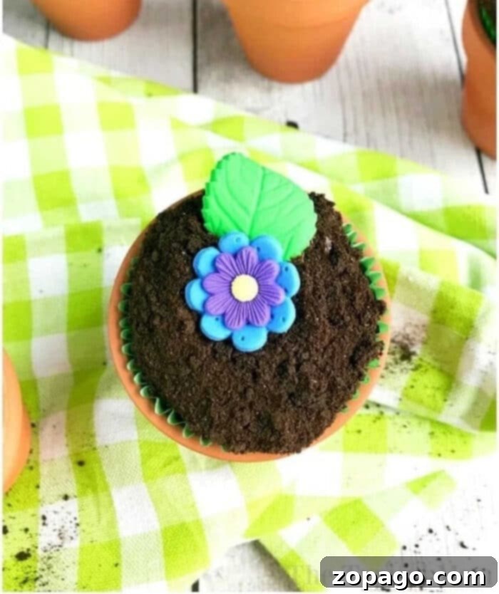 Flower Pot Cupcake Magic 8 A beautifully arranged selection of flower pot cupcakes with diverse edible flower decorations, showcasing their vibrant and charming appearance for a party.