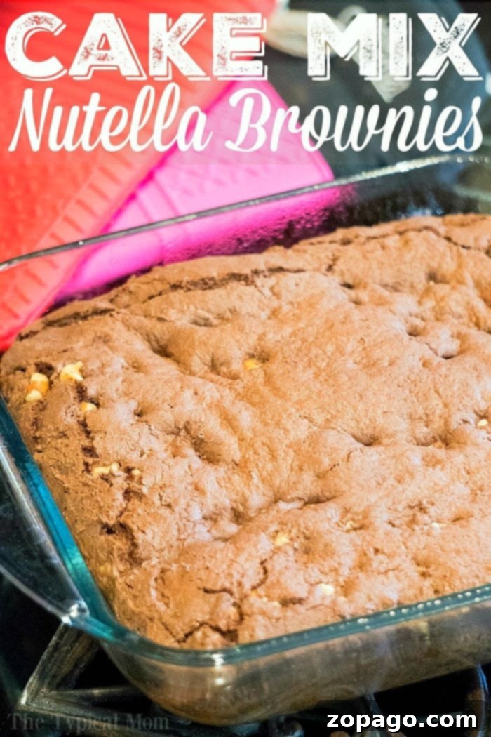 Brownies from cake mix Devils food variety are amazing. If you've never made Nutella brownies out of cake mix let me show you what you've been missing! #cakemix #brownies #nutella Fudgy Nutella brownies made from Devil's Food cake mix, cut into squares in a baking pan.