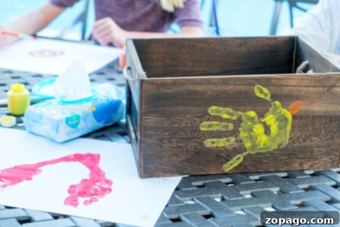 Perfect Presents for Amazing Educators 4 Completed butterfly handprint art on paper, with a child's handprint wings