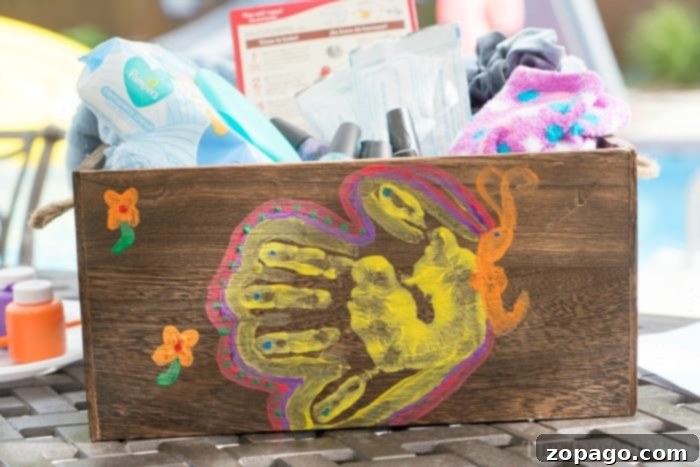 Perfect Presents for Amazing Educators 5 Butterfly handprint art decorating a gift box filled with appreciation gifts
