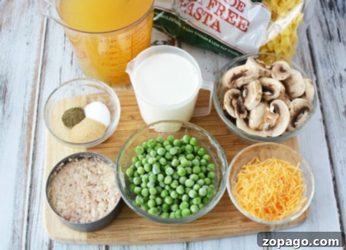 This pressure cooker tuna noodle casserole will bring you back to your childhood for sure. The comfort food you love can now be made in your Instant Pot for dinner in no time at all and is loaded with all the ingredients you once made in your oven. If you're looking for a new Instant Pot recipe to try this is it! #instantpot #pressurecooker #tunanoodlecasserole #casserole #tuna #pasta #dinner Pressure Cooker Tuna Noodle Casserole with a creamy sauce and green peas