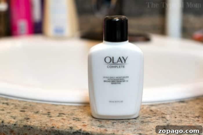The Mother Behind the Veil 3 Olay Complete All-Day Moisturizer with SPF 15, showcasing its texture.