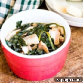 A bowl of spinach sits on a wooden table, steaming beside a checkered cloth, ready to enjoy from the instant pot.
