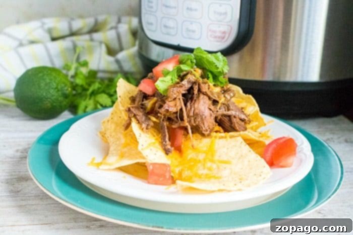 Here's an easy pressure cooker shredded beef tacos recipe you can make for dinner tonight! Flavorful tender beef in your Instant Pot has never been easier! #pressurecooker #instantpot #shredded #beef #tacos #healthy #easy Instant Pot Shredded Beef Tacos