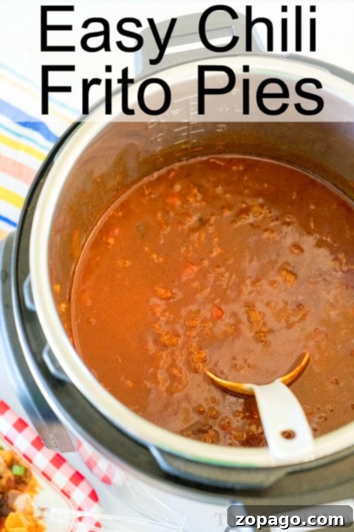 Frito chili pie recipe, a comforting dish made last night in our Instant Pot, was truly amazing! #instantpot #instantpotrecipe #easy #chili #fritopie Instant Pot filled with delicious chili, titled "Easy Chili Frito Pies," showcases the perfect Instant Pot Frito Chili Pie recipe, complete with a serving spoon inside.