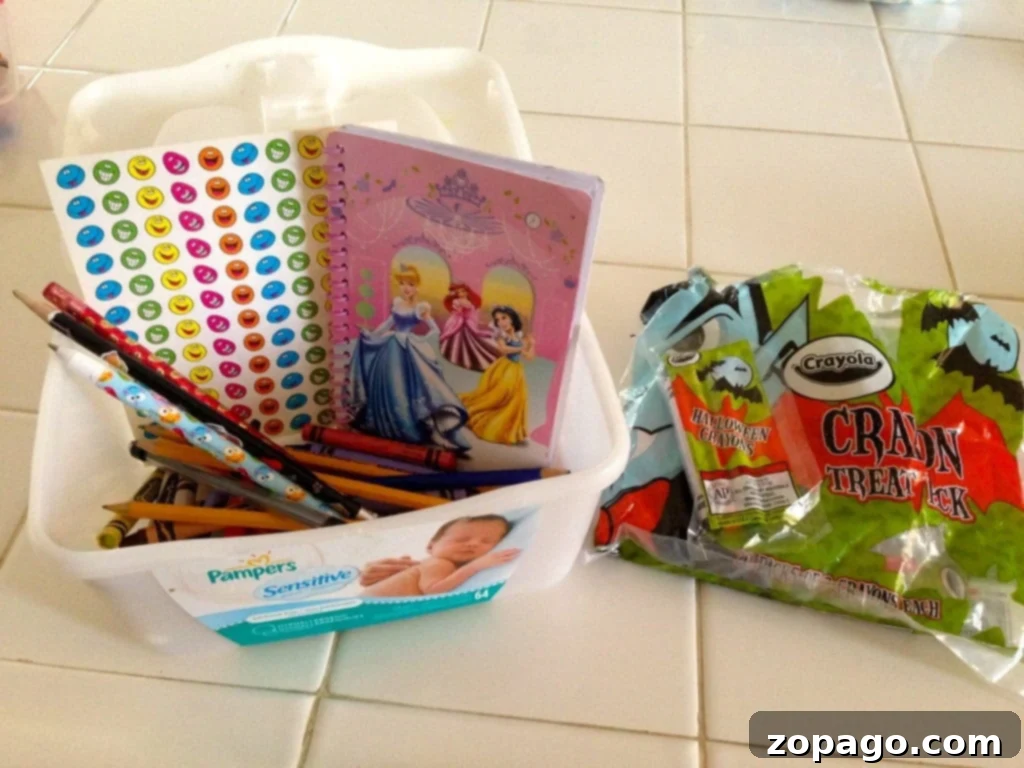 Kid-Friendly Restaurant Hacks 4 An open busy box with colored pencils and notebooks, stored in a car for impromptu kids' activities.