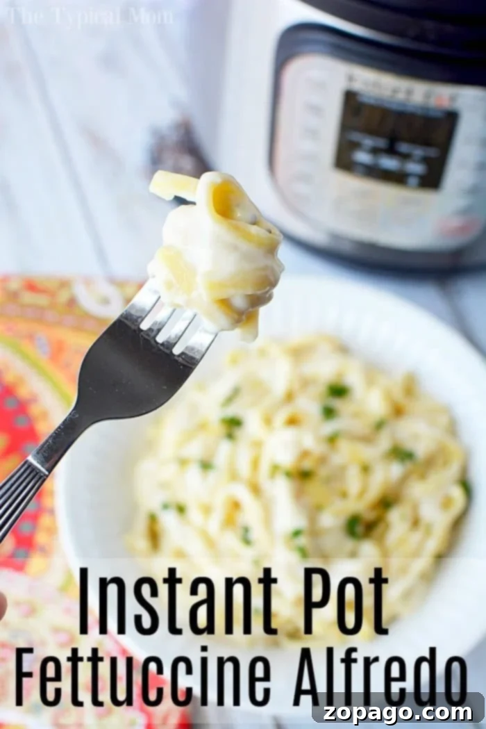 This Instant Pot fettuccine alfredo recipe is easy to make and a creamy buttery dinner your whole family is sure to love. Inexpensive pressure cooker meal. #instantpot #instantpotrecipes #alfredo #fettuccinealfredo #pasta #easy Instant Pot Fettuccine Alfredo in a white bowl, garnished with fresh parsley, on a patterned tablecloth.