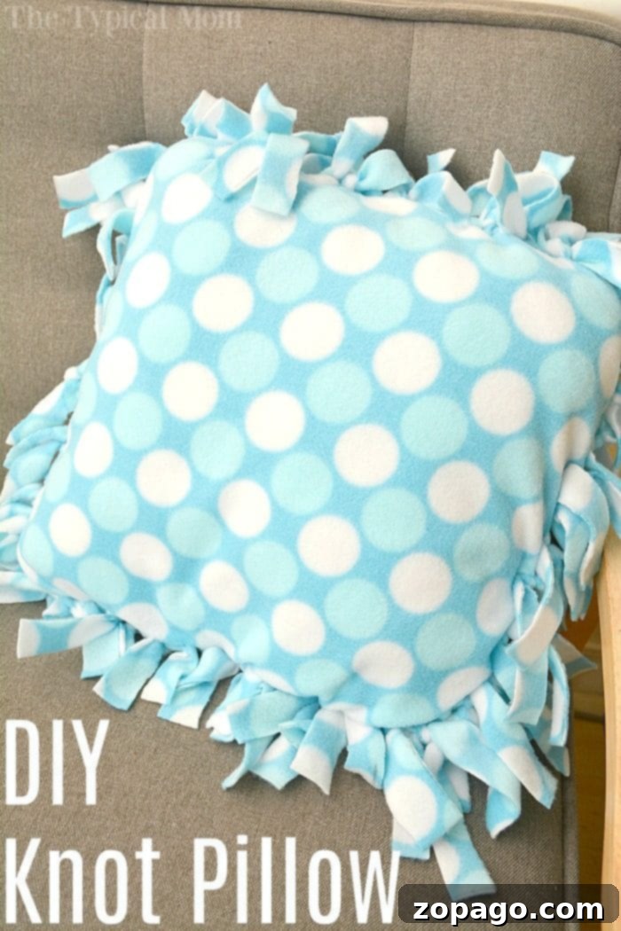 No-Sew Knot Pillow: Perfect for DIY Home Decor and Kids Crafts Finished blue polka dot knot pillow nestled on a green chevron cushion, ready for cozy home decor or a handmade gift. Easy no-sew craft idea.