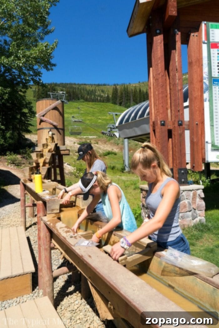 Gold panning activity for kids at Schweitzer Mountain Resort. Children gold panning at Schweitzer summer activities